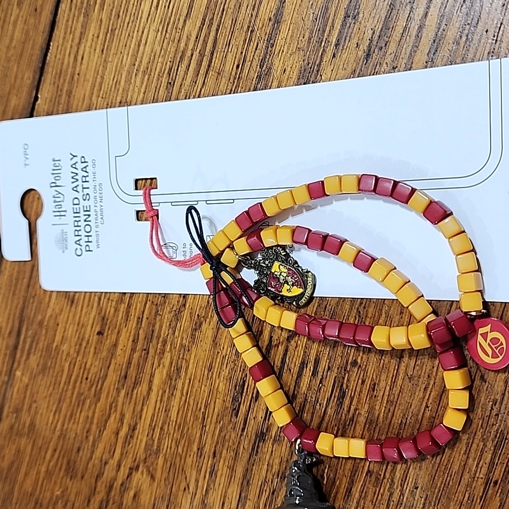 NWT Harry Potter Carried Away Phone Strap Red & Yellow With Charms